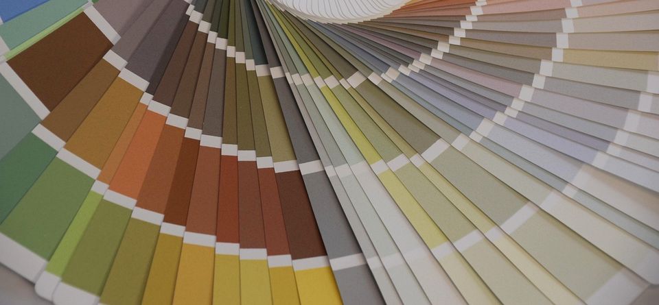 Open paint color fan deck showing many color samples